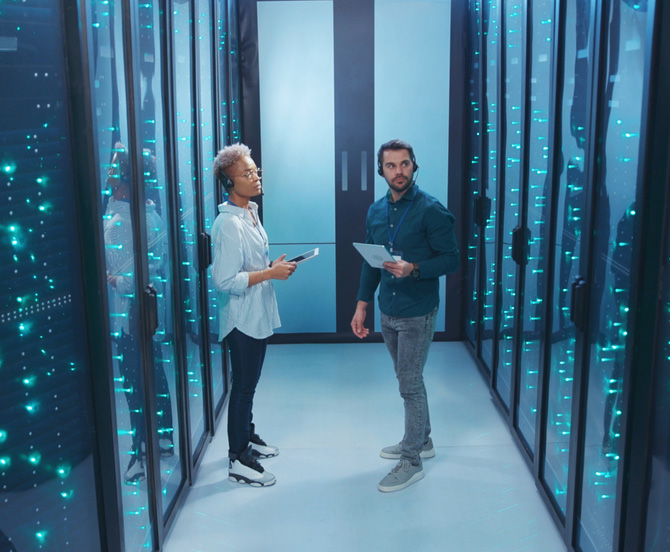 Two people in a data centre