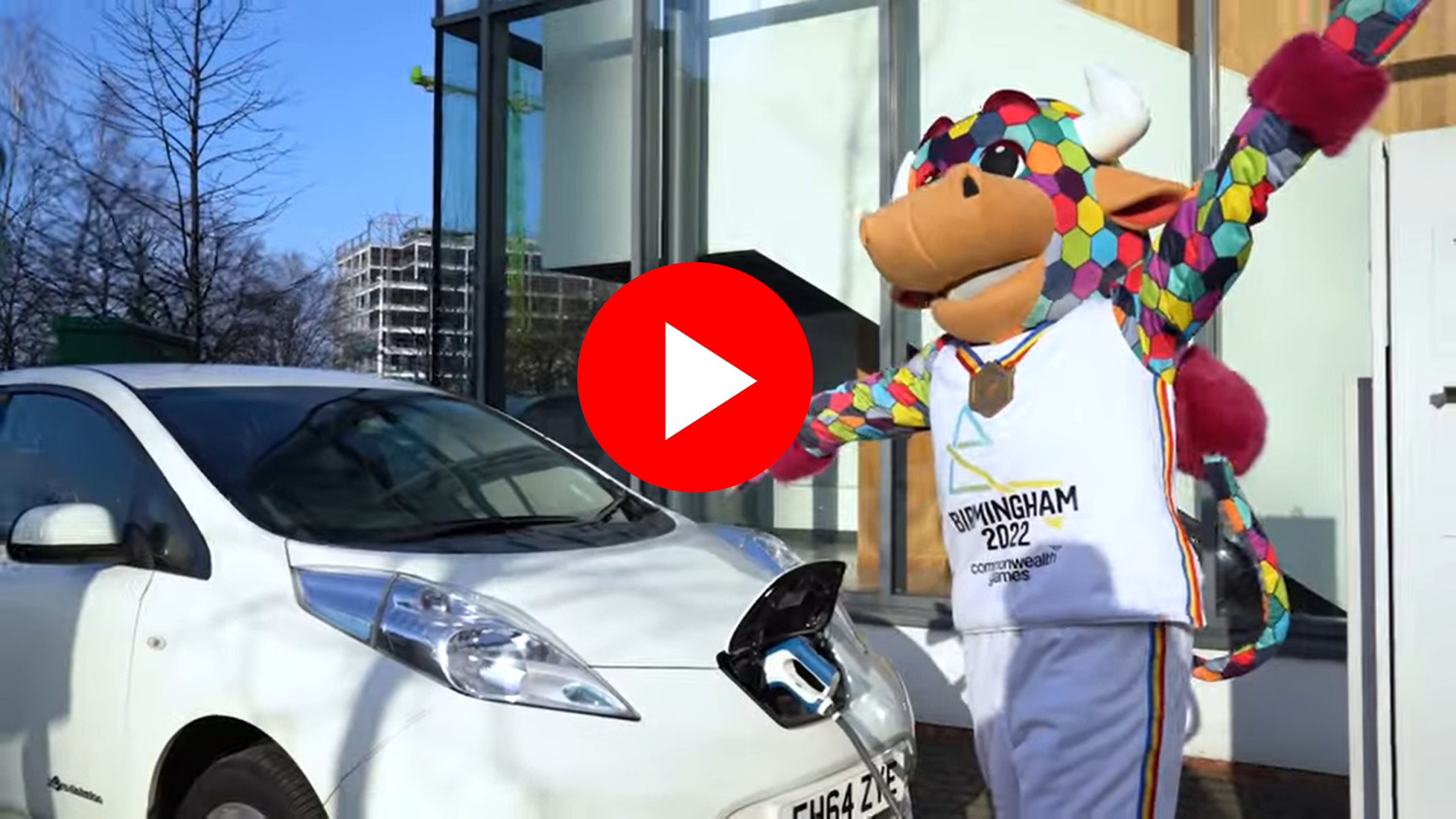 Commonwealth Games mascot charging electric car